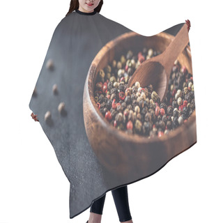 Personality  Close-up View Of Wooden Bowl And Spoon With Dried Aromatic Peppercorns On Black Hair Cutting Cape