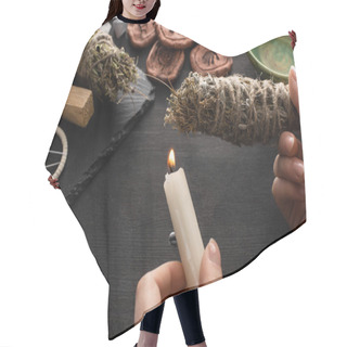 Personality  Cropped View Of Shaman Holding Candle And Smudge Stick Near Witchcraft On Black Wooden Background Hair Cutting Cape