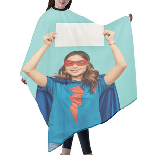 Personality  Carefree Preteen Girl In Superhero Costume With Cloak And Red Mask Holding Blank Paper Above Head And Looking At Camera On Blue Background, Happy Children's Day Concept  Hair Cutting Cape