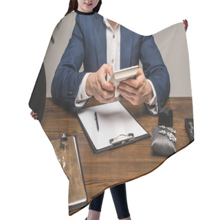 Personality  Cropped View Of Jewelry Appraiser Using Calculator Near Clipboard And Jewelry On Table Hair Cutting Cape