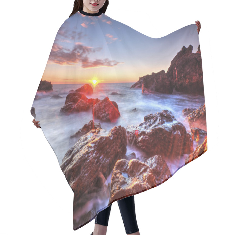 Personality  Sunrise on rocky shore and dramatic sky clouds hair cutting cape