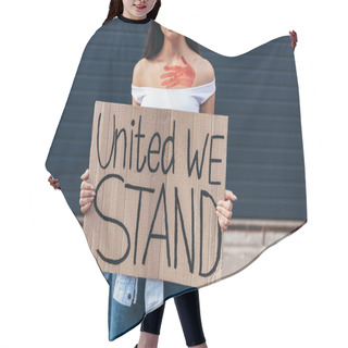 Personality  Cropped View Of Feminist Holding Placard With Inscription United We Stand On Street Hair Cutting Cape