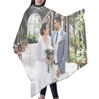 Personality  Side View Of Newlyweds Smiling At Each Other In Park  Hair Cutting Cape