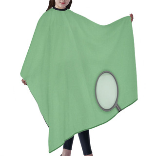 Personality  Top View Of Magnifying Glass On Green Background  Hair Cutting Cape