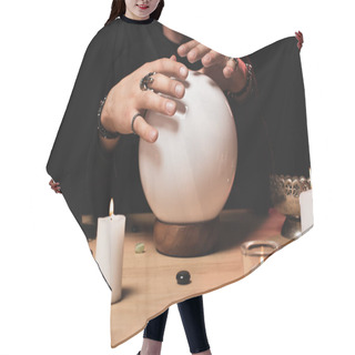 Personality  Cropped View Of Esoteric Holding Hands Above Crystal Ball Near Candles Isolated On Black  Hair Cutting Cape