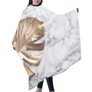 Personality  Golden Monstera Leaf On Luxury Marble Background. Clean Minimal Flat Lay Design. Tropical Gold Foliage For Trendy Layout. Luxury Fashion Lifestyle Concept. Hair Cutting Cape