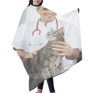 Personality  Doctor Smiling While Holding Ill Cat In Clinic Hair Cutting Cape