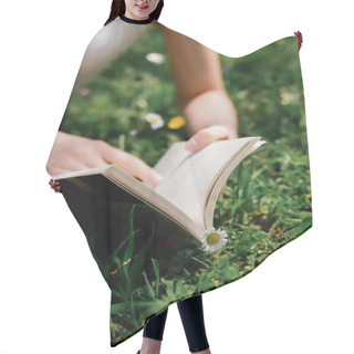 Personality  Cropped View Of Blurred Woman Holding Book On Meadow With Daisies  Hair Cutting Cape
