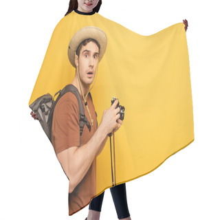 Personality  Shocked Traveler In Hat With Backpack Holding Photo Camera On Yellow Hair Cutting Cape
