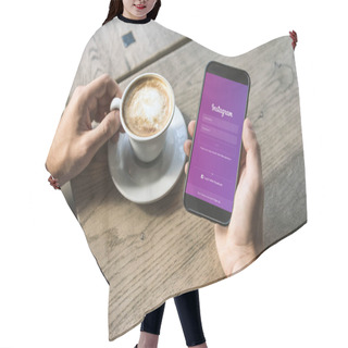 Personality  Cropped Shot Of Man With Cup Of Cappuccino Using Smartphone With Instagram App On Screen Hair Cutting Cape