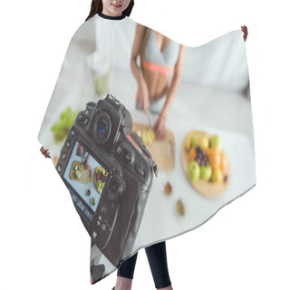 Personality  Selective Focus Of Digital Camera With Girl Cutting Apple On Screen  Hair Cutting Cape