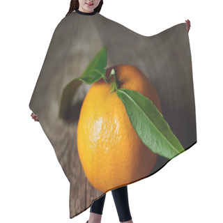 Personality  Selective Focus Of Tasty Tangerine With Green Leaves On Wooden Table  Hair Cutting Cape