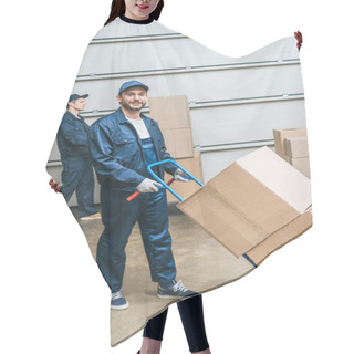 Personality  Two Movers In Uniform Transporting Cardboard Boxes With Hand Truck In Warehouse   Hair Cutting Cape