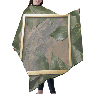 Personality  Top View Of Golden Frame On Stone Background With Copy Space And Green Leaves Hair Cutting Cape