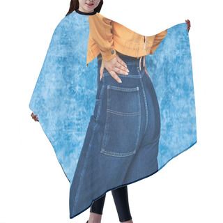 Personality  Cropped View Of Anonymous Plus Size Woman In Orange Jacket And Denim Jeans Posing With Hand On Hip While Standing With Hand On Hip On Mottled Blue Background, Body Positive  Hair Cutting Cape