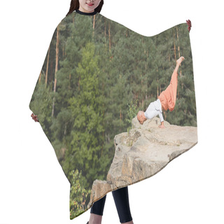 Personality  Buddhist In Harem Pants Practicing Arm Balancing Pose On Rocky Cliff In Forest Hair Cutting Cape