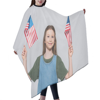 Personality  Patriotic Preteen Girl Smiling While Holding Flags Of America During Memorial Day Isolated On Grey  Hair Cutting Cape