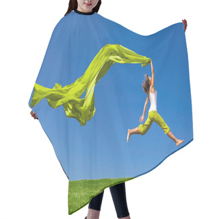 Personality  Woman Jumping On A Green Meadow With A Colored Tissue Hair Cutting Cape