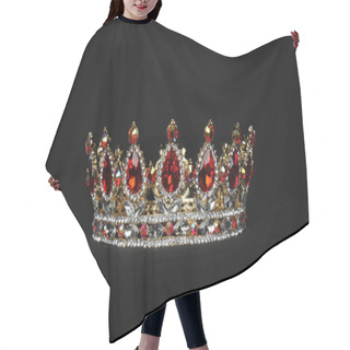 Personality  Close Up Of Red And Gold Crown On Black Studio Background. Hair Cutting Cape