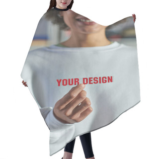 Personality  Cropped View Of Smiling Blurred African American Designer In Sweatshirt Holding Printing Layer With Your Design Lettering In Print Studio, Focused Business Owner Managing Workshop Hair Cutting Cape