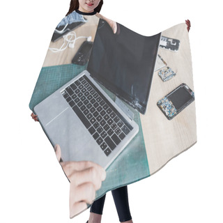 Personality  Cropped View Of Repairman Holding Damaged Laptop With Blank Screen On Workplace With Disassembled Parts Of Mobile Phones Hair Cutting Cape