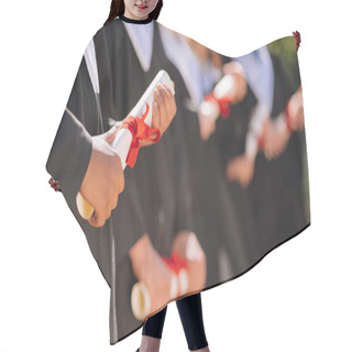 Personality  Graduates Holding Their Diplomas In A Roll. Hair Cutting Cape