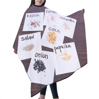 Personality  Different Seeds On Pieces Of Paper On Wooden Background Hair Cutting Cape