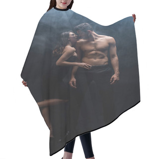 Personality  Full Length Of Sensual Woman Touching Belt Of Muscular Man On Black Background With Smoke Hair Cutting Cape