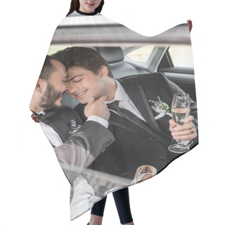 Personality  Cheerful Gay Groom In Classic Suit With Boutonniere Touching Chin Of Young Boyfriend In Braces And Holding Glass Of Champagne While Sitting On Backseat Of Car  Hair Cutting Cape