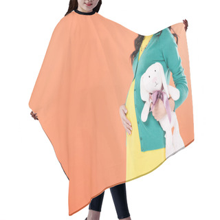 Personality  Cropped View Of Pregnant Woman Touching Belly And Holding Toy Rabbit Isolated On Orange  Hair Cutting Cape