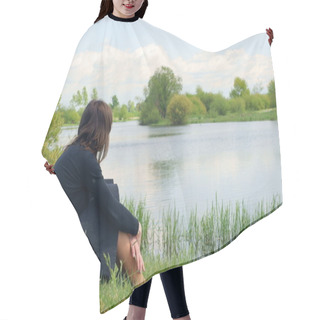Personality  A Woman Sits Alone And Looks Out Across The River. Hair Cutting Cape