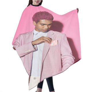 Personality  Handsome Man With Curly Pink Hair In Stylish Attire On Pink Backdrop With Present In His Pocket Hair Cutting Cape