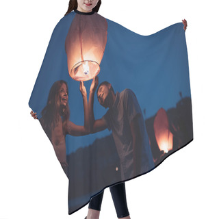 Personality  Young Couple Looking At Sky Lantern On River Beach In Evening Hair Cutting Cape