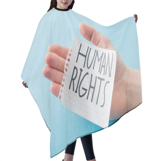 Personality  Cropped View Of Woman Holding Paper With Human Rights Lettering Isolated On Blue  Hair Cutting Cape