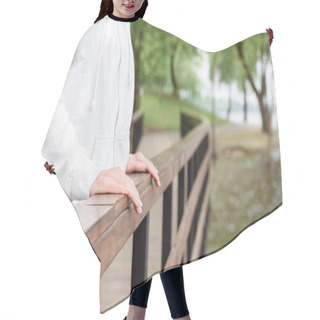 Personality  Cropped View Of Woman Standing Alone Near Railings In Park Hair Cutting Cape