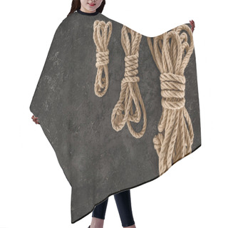 Personality  Top View Of Arrangement Of Tied Brown Marine Ropes On Dark Concrete Surface Hair Cutting Cape