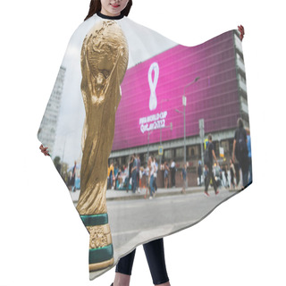 Personality  4 September 2019, Moscow, Russia. Copy Of World Cup Trophy On Background Logo Of The FIFA World Cup 2022, Which Will Be Held In Qatar, On A Giant Screen In The City Center. Hair Cutting Cape