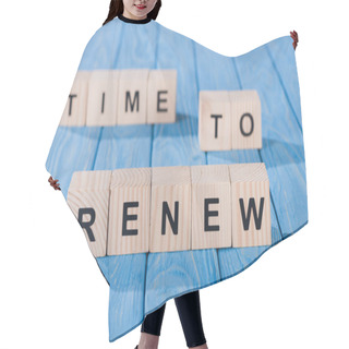 Personality  Close Up View Of Arranged Wooden Blocks Into Time To Renew Phrase On Blue Wooden Surface  Hair Cutting Cape