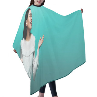 Personality  Happy Brunette Asian Woman Showing Shrug Gesture On Turquoise Background, Panoramic Shot Hair Cutting Cape