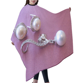 Personality  Earrings And Pendent With Sea Pearls And Cubic Zirconias On A Pink Background Close Up. Hair Cutting Cape