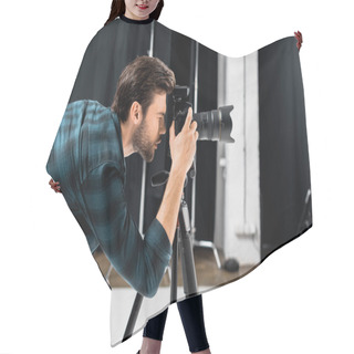 Personality  Side View Of Professional Young Photographer Working With Camera In Photo Studio Hair Cutting Cape