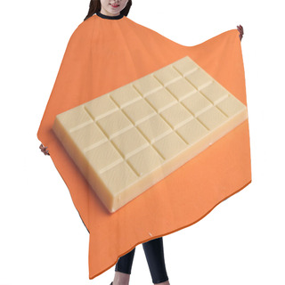 Personality  A Closeup Of A Whole White Chocolate Bar Isolated On An Orange Background Hair Cutting Cape