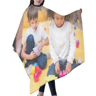 Personality  Upset African American Child Playing With Colored Constructor In Kindergarten Hair Cutting Cape