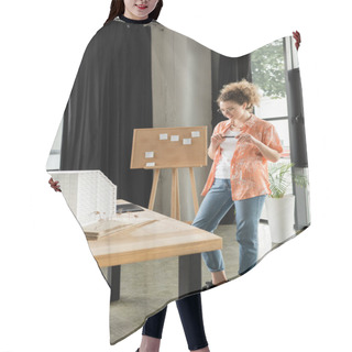 Personality  Happy Architectural Designer Holding Stylus And Looking At Residential House Model In Office Hair Cutting Cape