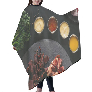 Personality  Top View Of Gourmet Craft Meat With Various Sauces On Black Hair Cutting Cape