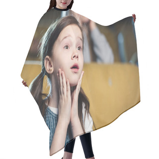 Personality  Selective Focus Of Cute Worried Child Watching Movie In Cinema Hair Cutting Cape