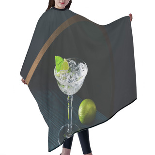 Personality  High Angle View Of Cocktail Glass With Ice, Mint Leaf And Whole Lime On Blue Wooden Surface On Geometric Background With Golden Circle Hair Cutting Cape