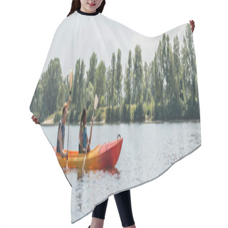 Personality  Side View Of Young Man And African American Woman In Life Vests Sailing In Sportive Kayak During Active Summer Weekend On Picturesque River With Green Trees On Bank, Banner Hair Cutting Cape