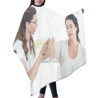 Personality  Therapist Holding Her Patients Arm Hair Cutting Cape