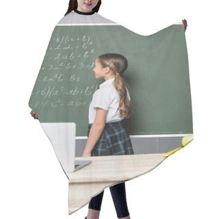 Personality  Schoolgirl Standing Near Chalkboard With Equations And Desk With Laptop  Hair Cutting Cape